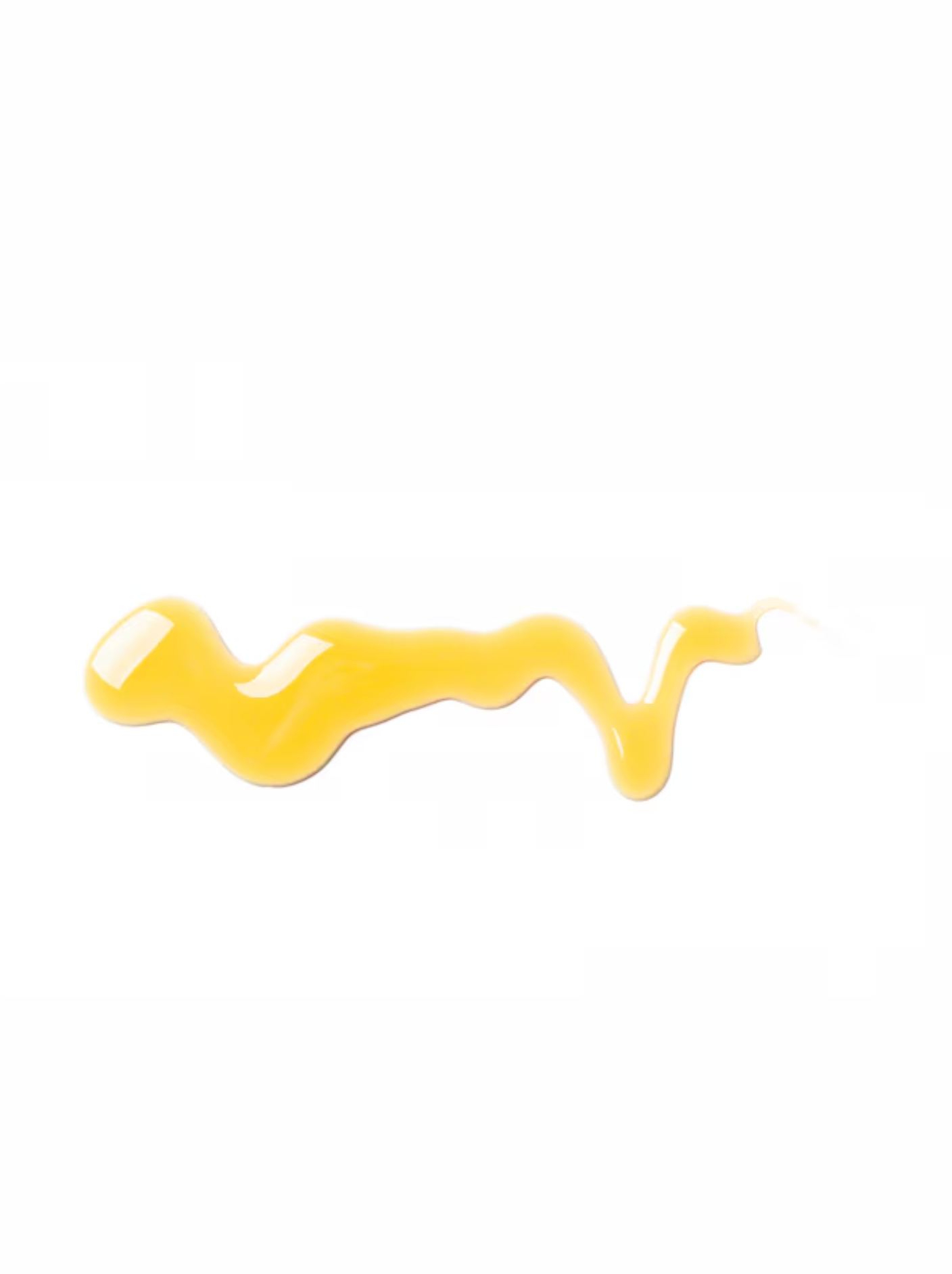 A golden, viscous smear of organic castor oil isolated on a clean white background.