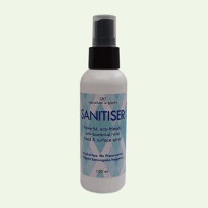 A 100ml bottle of Absolute Organix eco-friendly anti-bacterial hand and surface spray with a black pump nozzle.