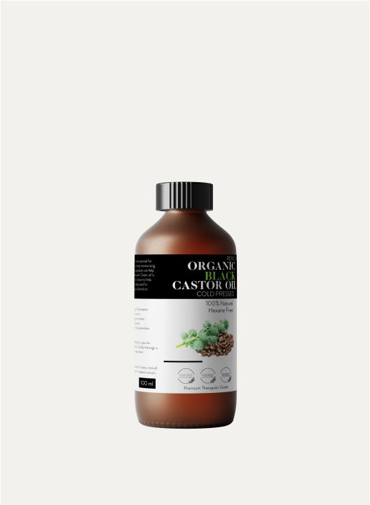 A brown glass bottle of organic cold-pressed black castor oil with a black cap against a plain background.